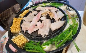 mookata filled with noodles and vegetables